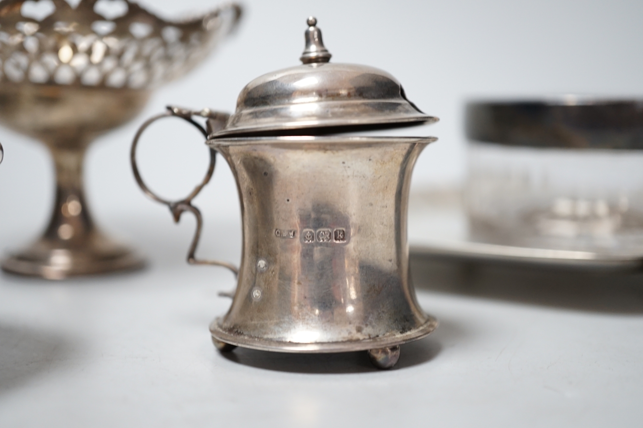 Sundry small silver including a late Victorian silver waiter, Birmingham, 1899, 14.5cm, two silver mounted toilet jars, a silver mustard pot and pair of silver pedestal tazzes.